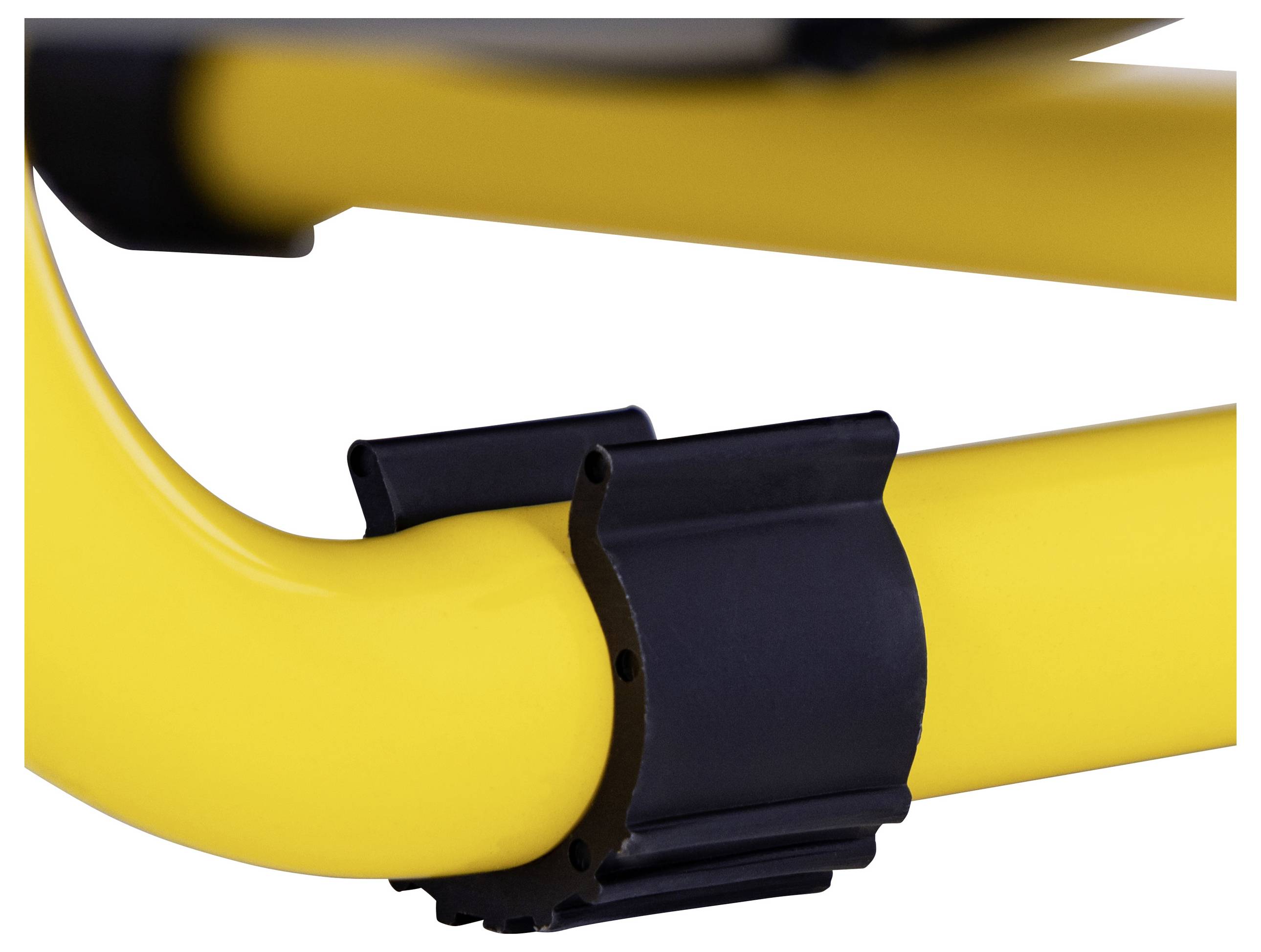 A close-up of a yellow curved tube joined securely with a black clamp, highlighting the sturdy construction of a structural component.