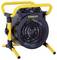A yellow and black portable electric heater with a circular grill and two control knobs, labeled 'Stanley', designed for efficient heating.