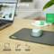 A green mouse on a grey mousemat, emphasising gliding and movement. Dimensions: 250x210x3mm. Features: Non-slip, flexible.