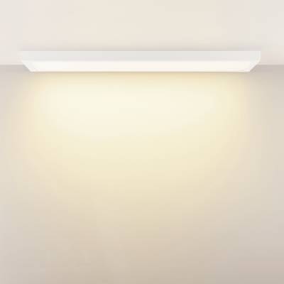 Minimalist LED ceiling light with warm white light, evenly distributed throughout a room.