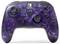Black Nintendo Switch Controller with purple cosmic illustrations, multiple buttons and controls. Playful design with a space-themed aesthetic.