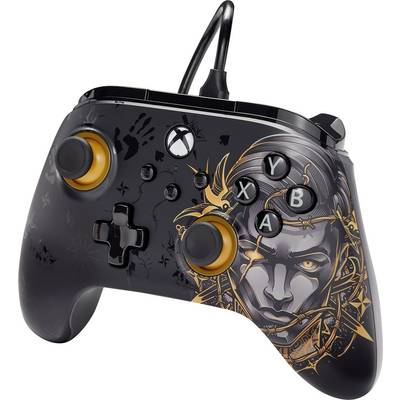 Black gaming controller with golden accents and a stylised head in orange-gold tones on the front.