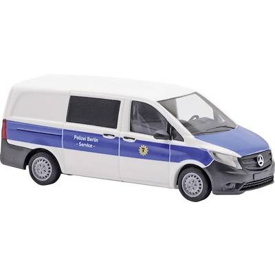 A white van with a blue side stripe and police emblem, marked with 'Police Berlin - Service'.