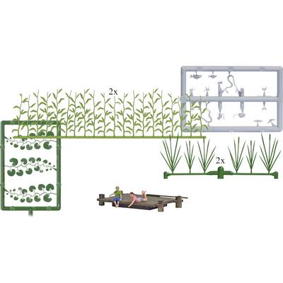 A plastic model kit with plant parts and figures, showing two people lying on a wooden walkway. Kit contains plants, animals, and figures.