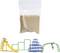 A small plastic bag contains sand. Beneath it are miniature play equipment: a yellow slide, green climbing frames, and blue cubes. A human figurine is playing on them to scale.