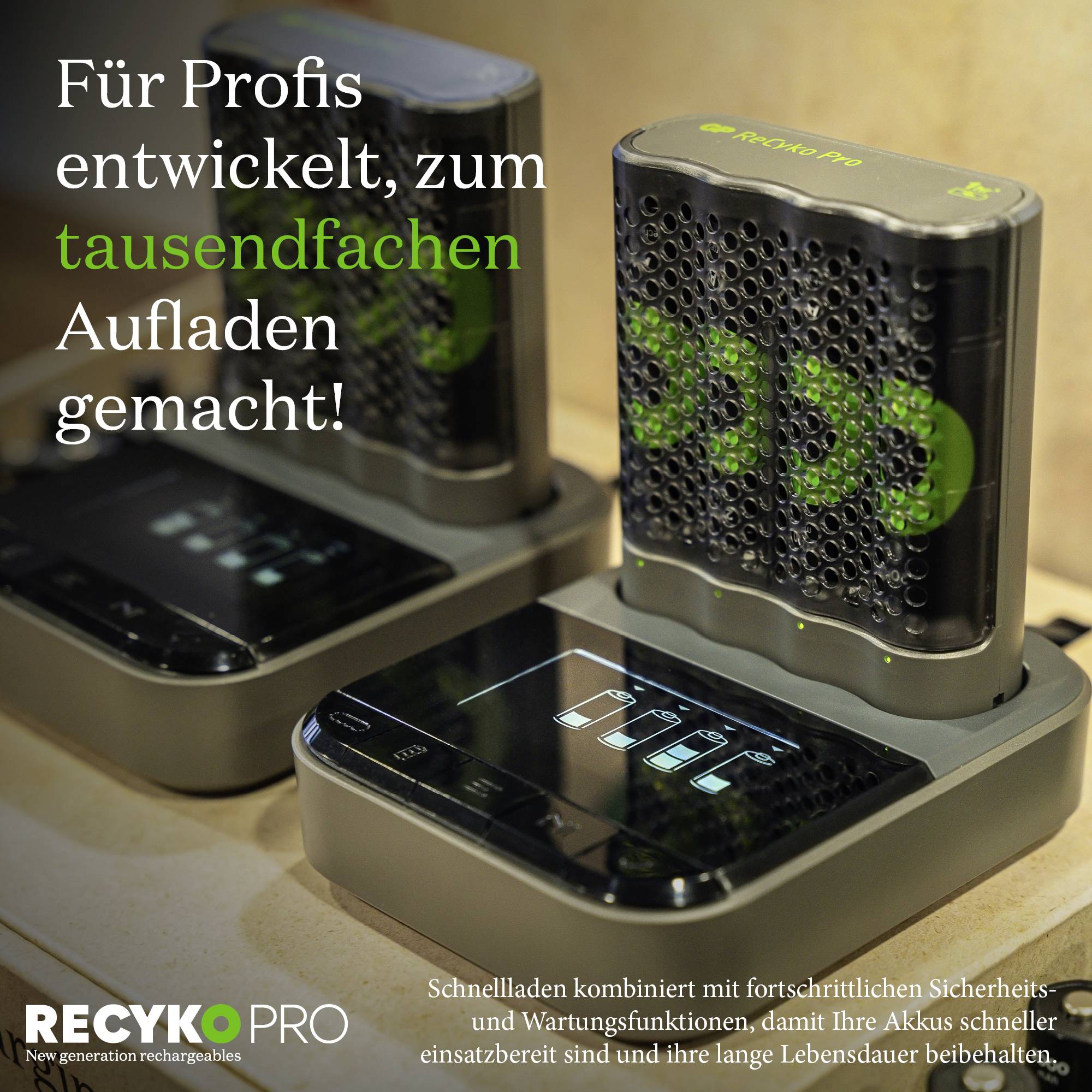 Charger with two batteries on docking station. Text: 'Developed for professionals, made for charging thousands of times!' Brand: Recyko.