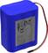 Blue, rectangular battery with red and black cables, with a label featuring text and symbols.