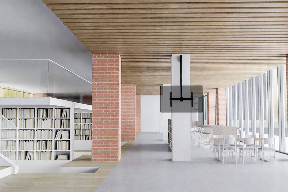 Modern library with large windows, wooden accents and red brick walls. Bookshelves and seating areas provide reading spaces.