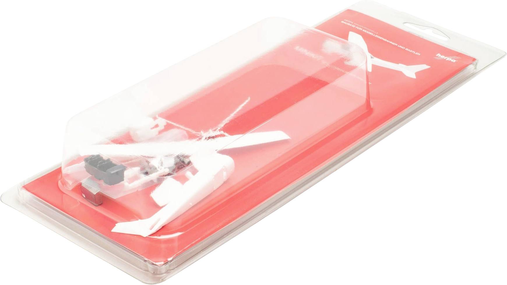 Toy helicopter in a red, transparent packaging.