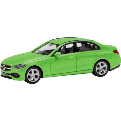 Green model car of a four-door Mercedes-Benz. It stands on a flat surface and is viewed from the right side.