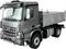 Grey lorry viewed from the side with an open cargo bed. Ideal for transport or construction projects.