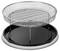 A round, silver metal barbecue with a flat grated grill and a black, removable base, positioned on a table.