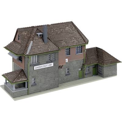 A model building of a railway station with the inscription 'Darmstadt Hbf'. It has a detailed tiled roof and green window shutters.