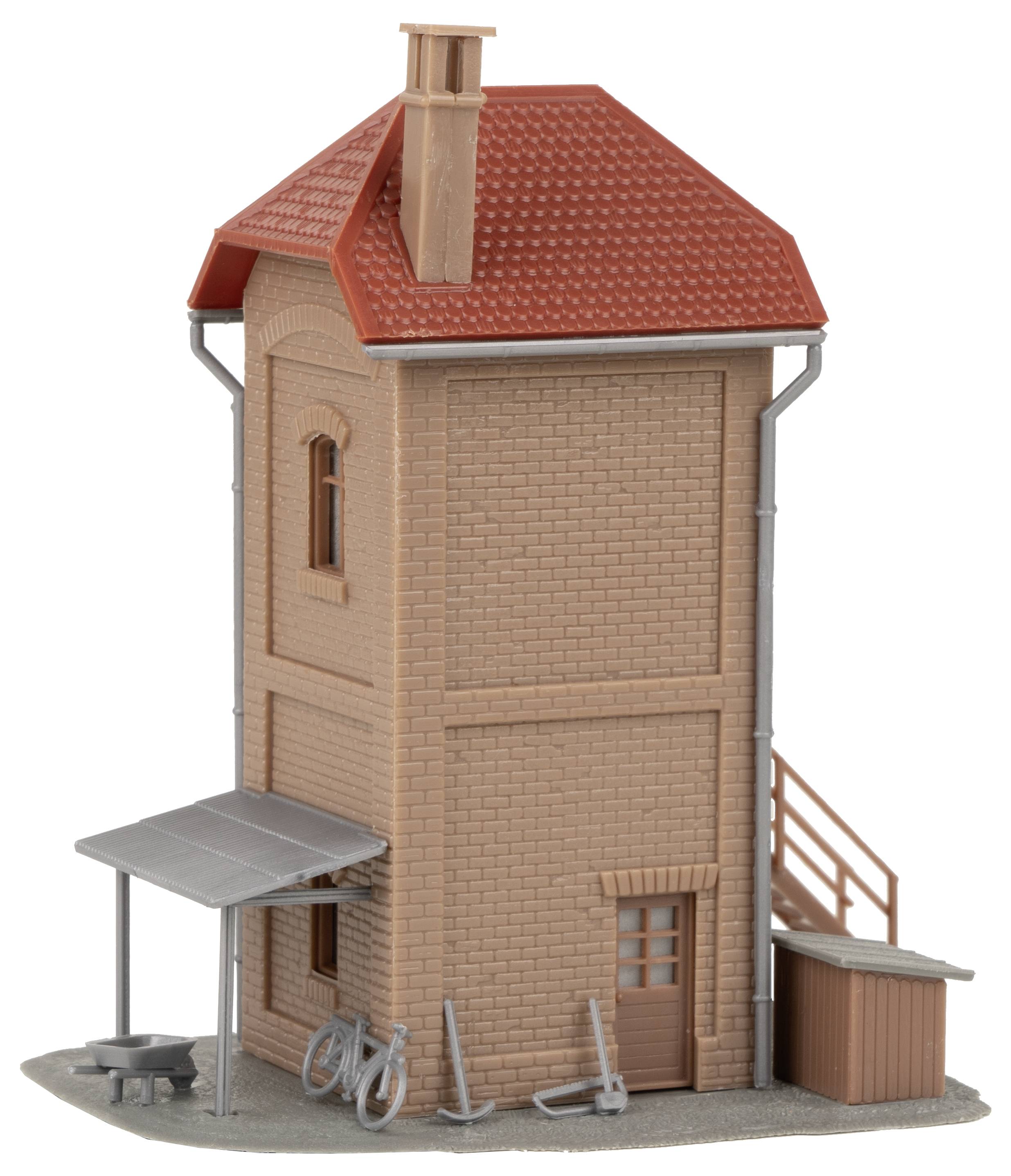 A model building with a red roof and brick facade. A small covered area on the side features a bicycle.