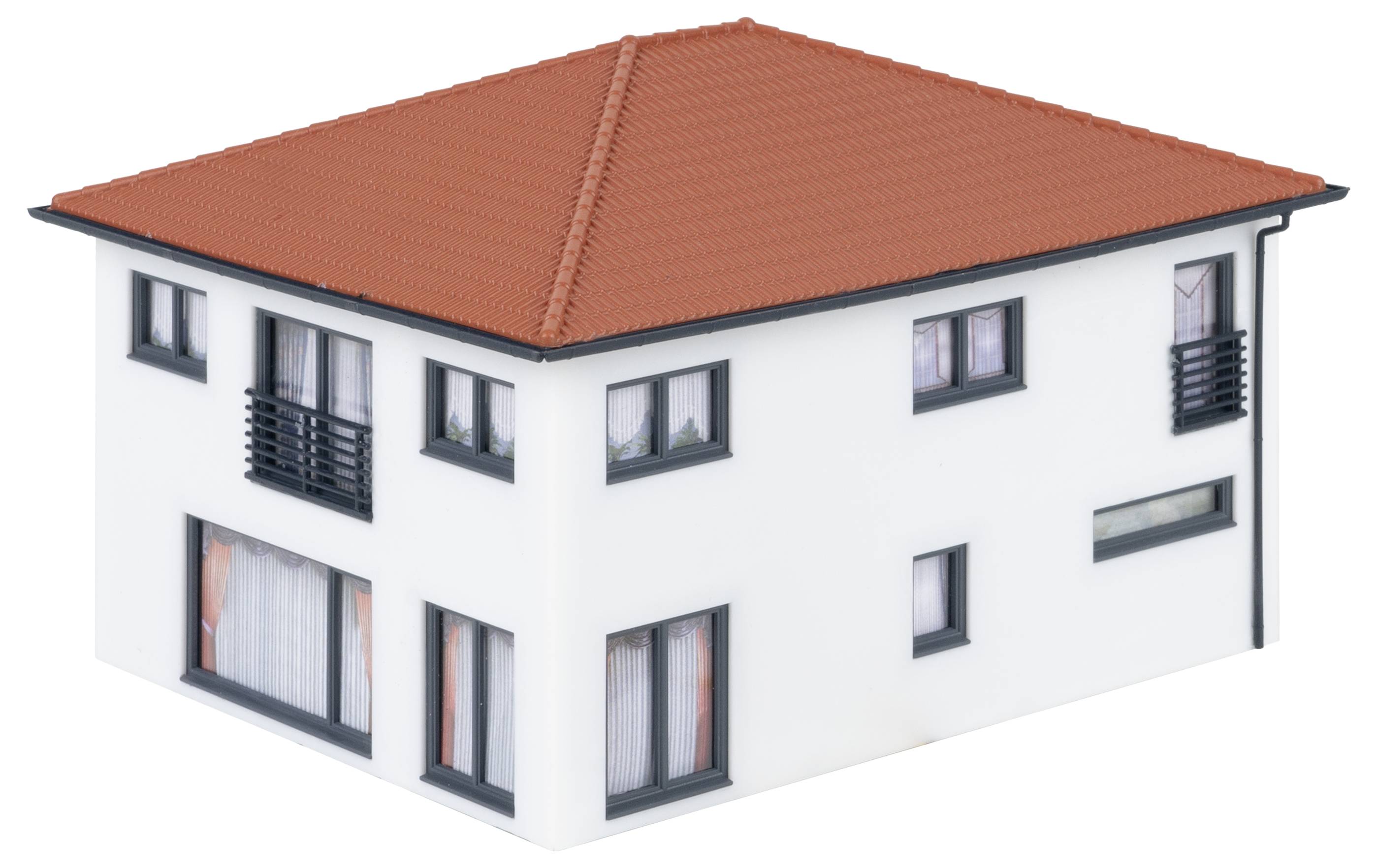 A two-storey model house with a white facade and a red pitched roof. Large windows and modern architecture.