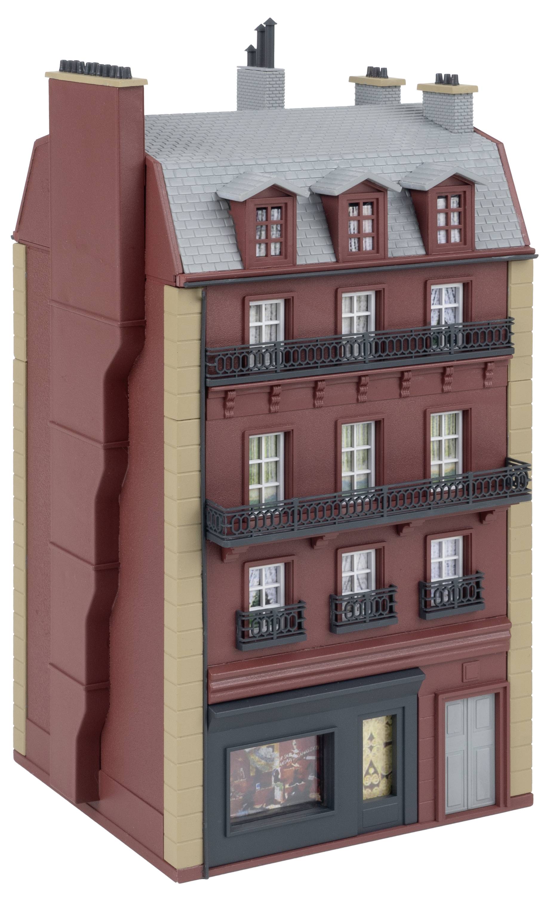 A model of a multi-storey building with red brick, grey roof, and black-decorated balconies. A shop window at ground level.