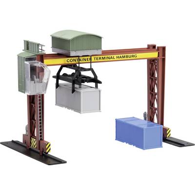 A model of a container crane with the inscription 'Container Terminal Hamburg', lifting a white container. A blue container is positioned beside it.