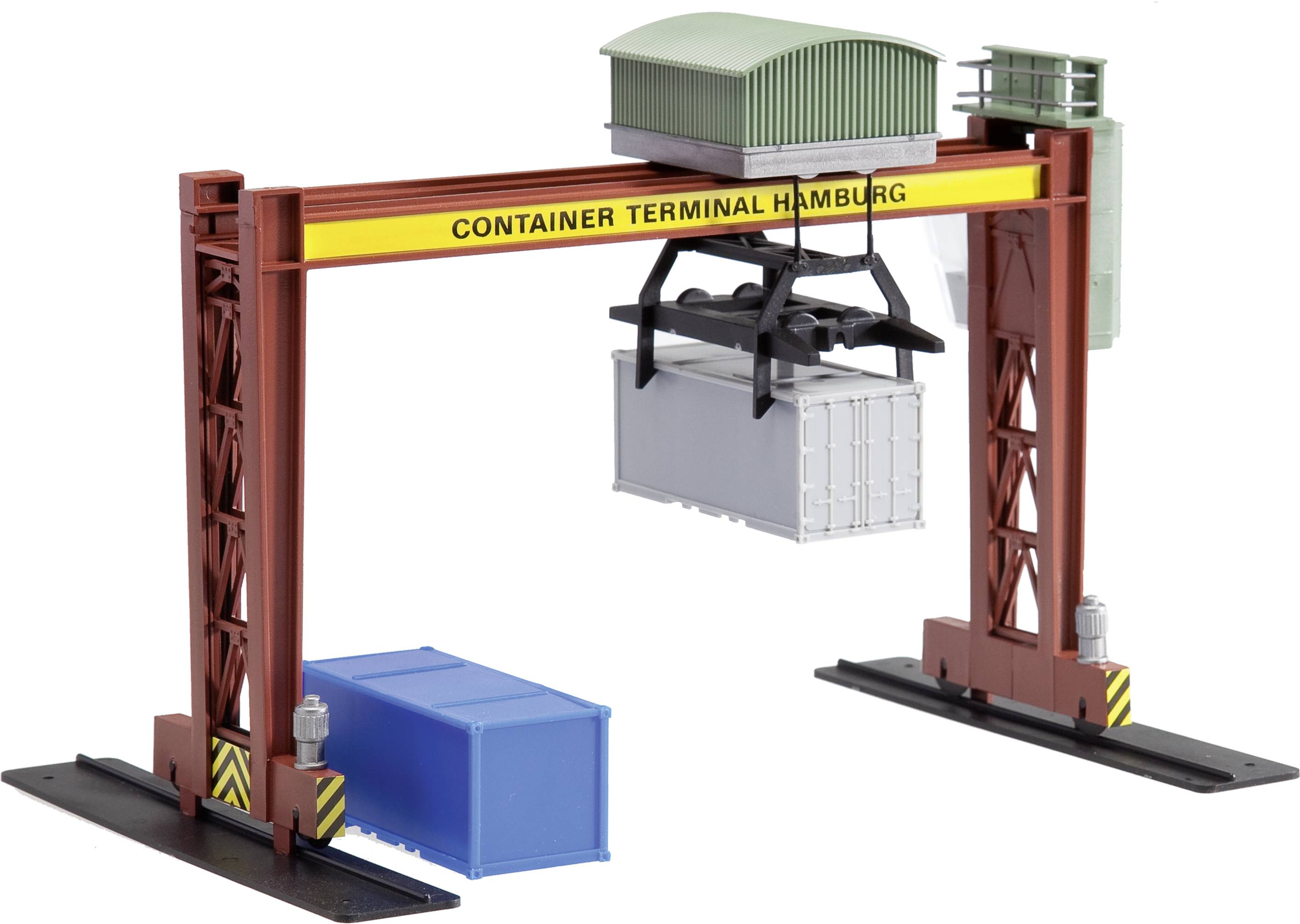 A model crane at the 'Container Terminal Hamburg' lifts a grey container from a blue container.