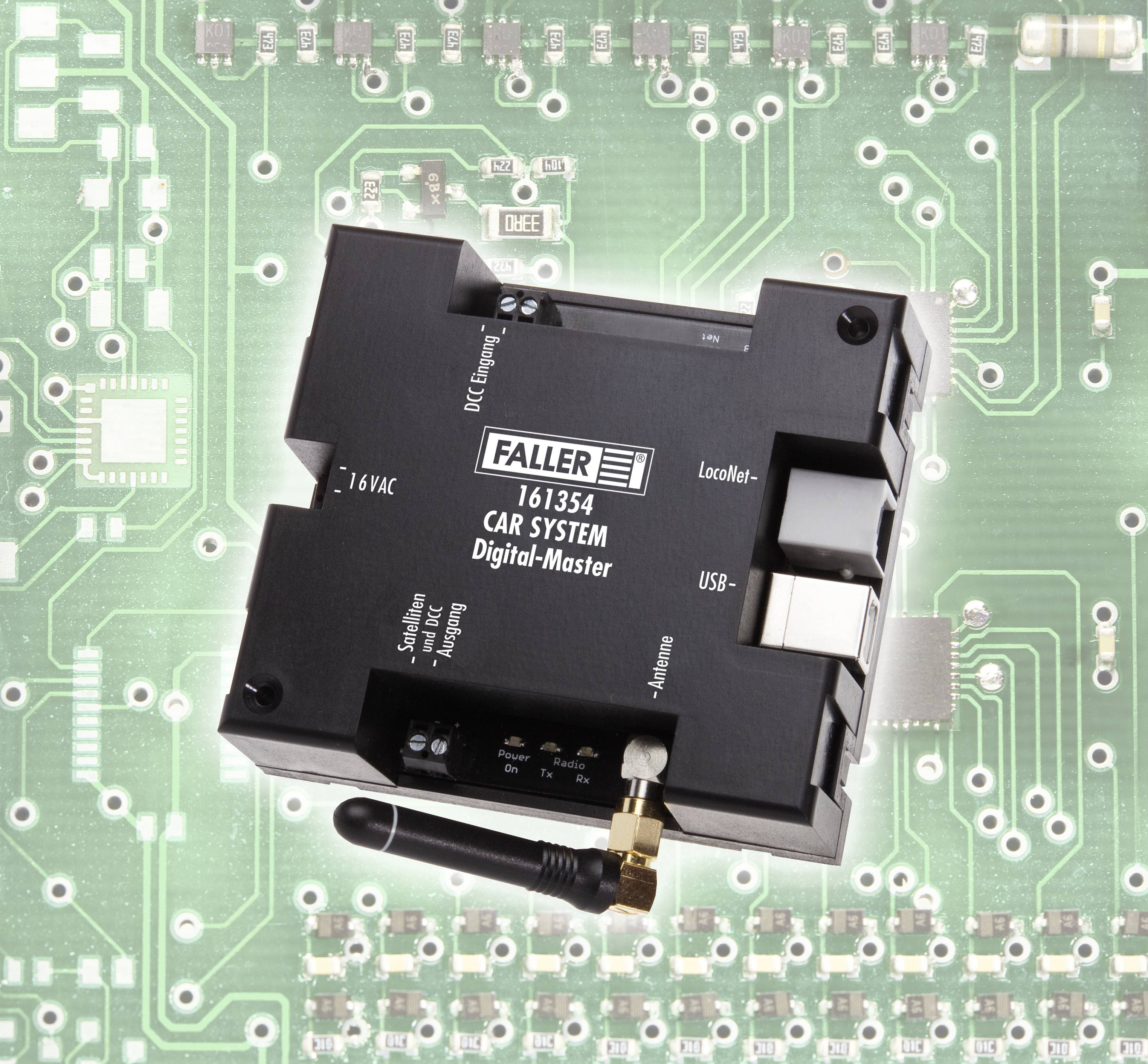 A Faller Car System Digital Master Module, model number 161354, is situated on a circuit board. It displays connections for power and USB.