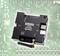 A Faller Car System Digital Master Module, model number 161354, is situated on a circuit board. It displays connections for power and USB.