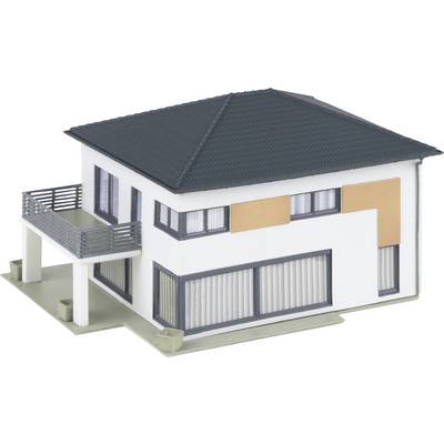 Modern detached house with a flat roof and balconies, white with grey accents.