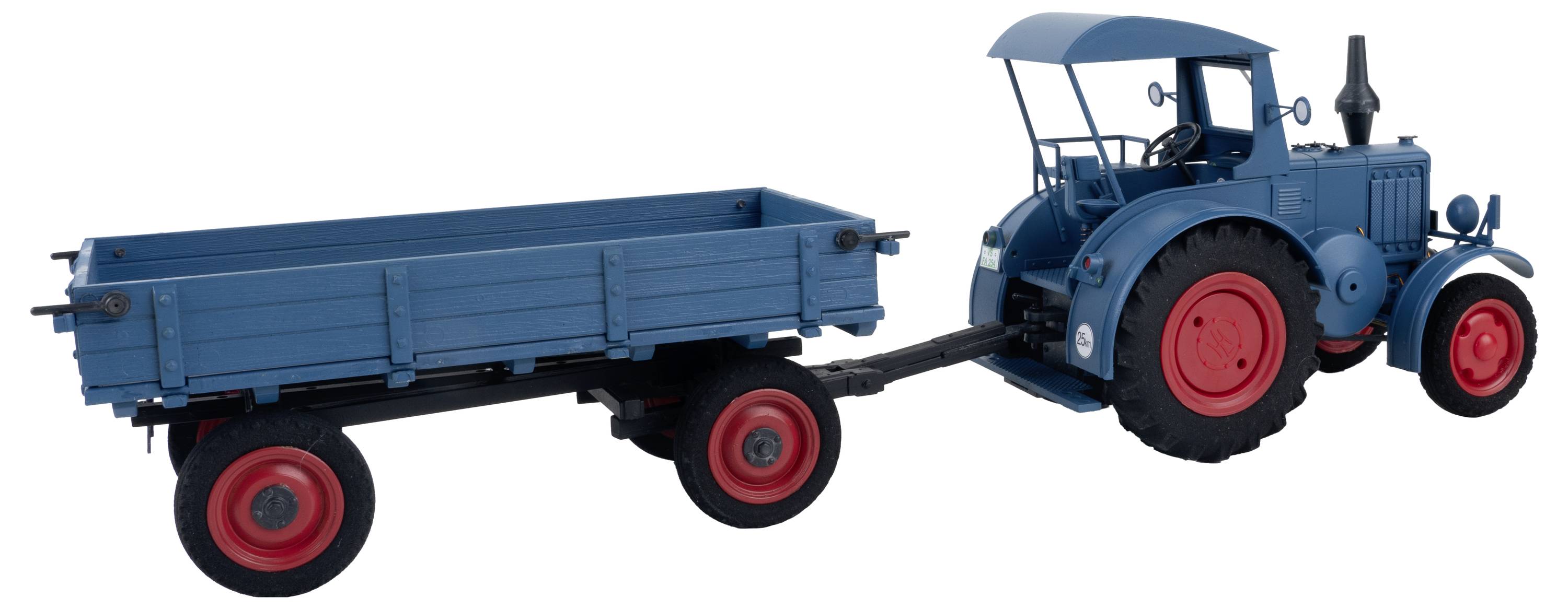 Blue tractor with a red roof and trailer. The tractor has large red wheels and is hitched to an open blue trailer.
