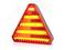Red warning triangle with yellow light, standing on a flat surface. It signals danger or a breakdown.<br><br>Translation to British English:<br>Red warning triangle with yellow light, standing on a level surface. It indicates danger or a vehicle breakdown.