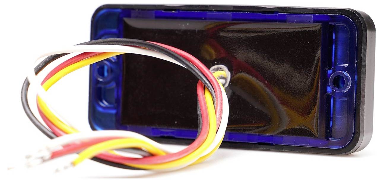 A black electronic component with colourful cables being led out. It could be part of a circuit or device.