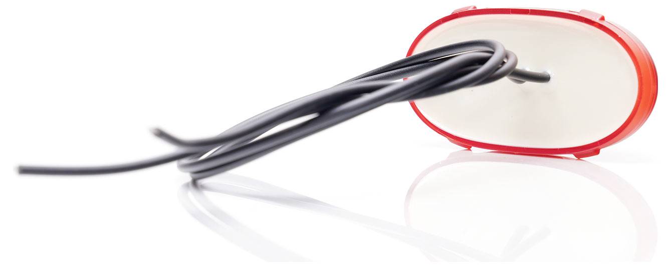 A red rear light with a black cable connected to a reversing lamp, set against a white background.