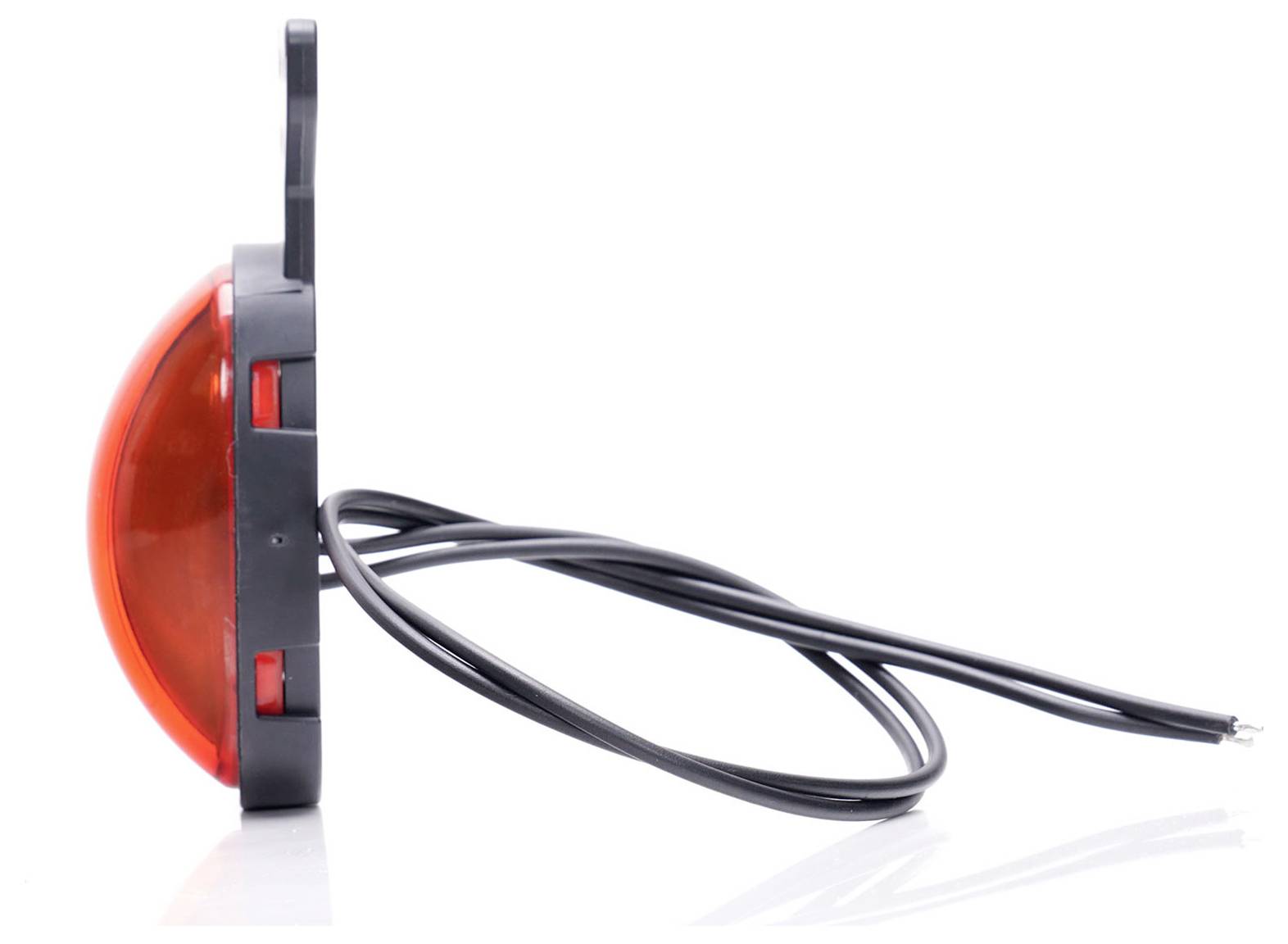 A side-view red rear light with black cables protruding from the back.