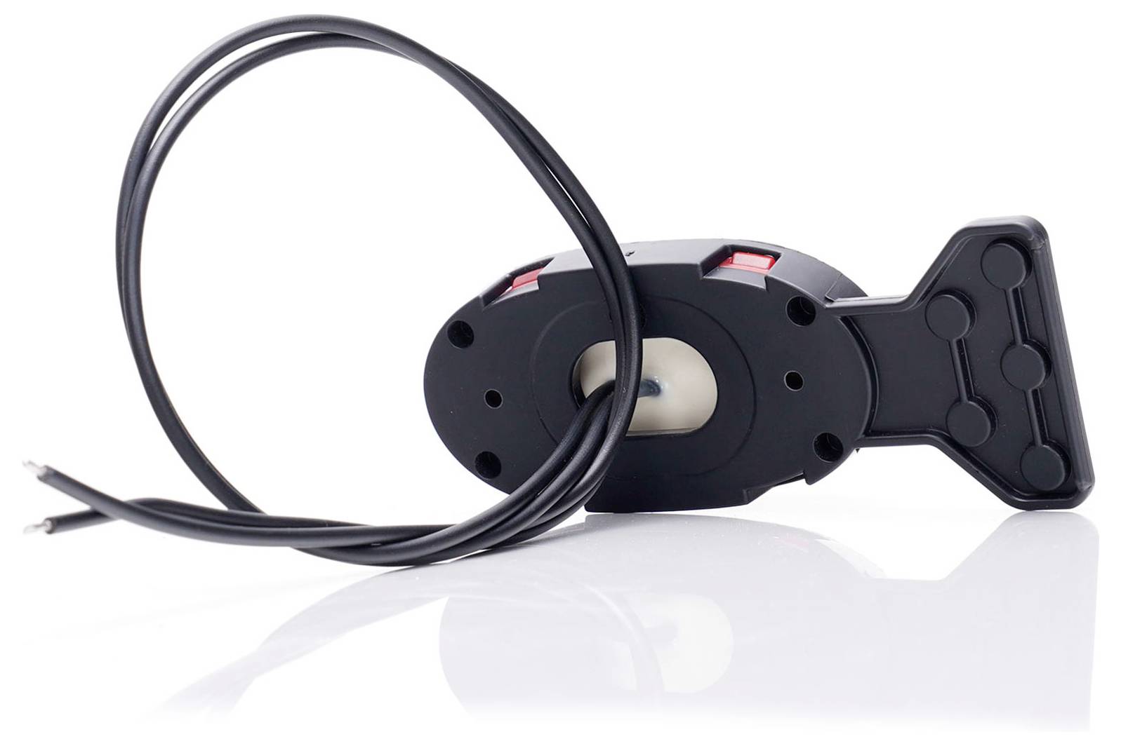 A black, wired sensor with a mount that looks like an arrow. It is resting on a glossy surface.