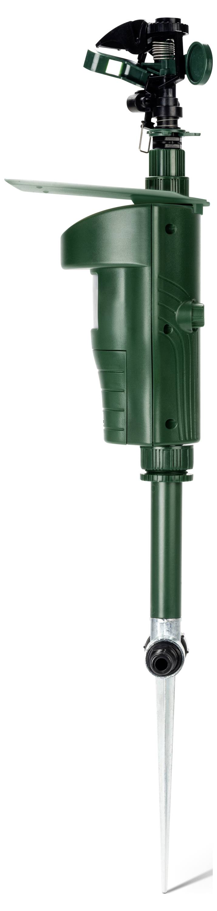 A green lawn sprinkler with a rotating head mounted on a spike for the garden. Suitable for evenly watering lawn areas.