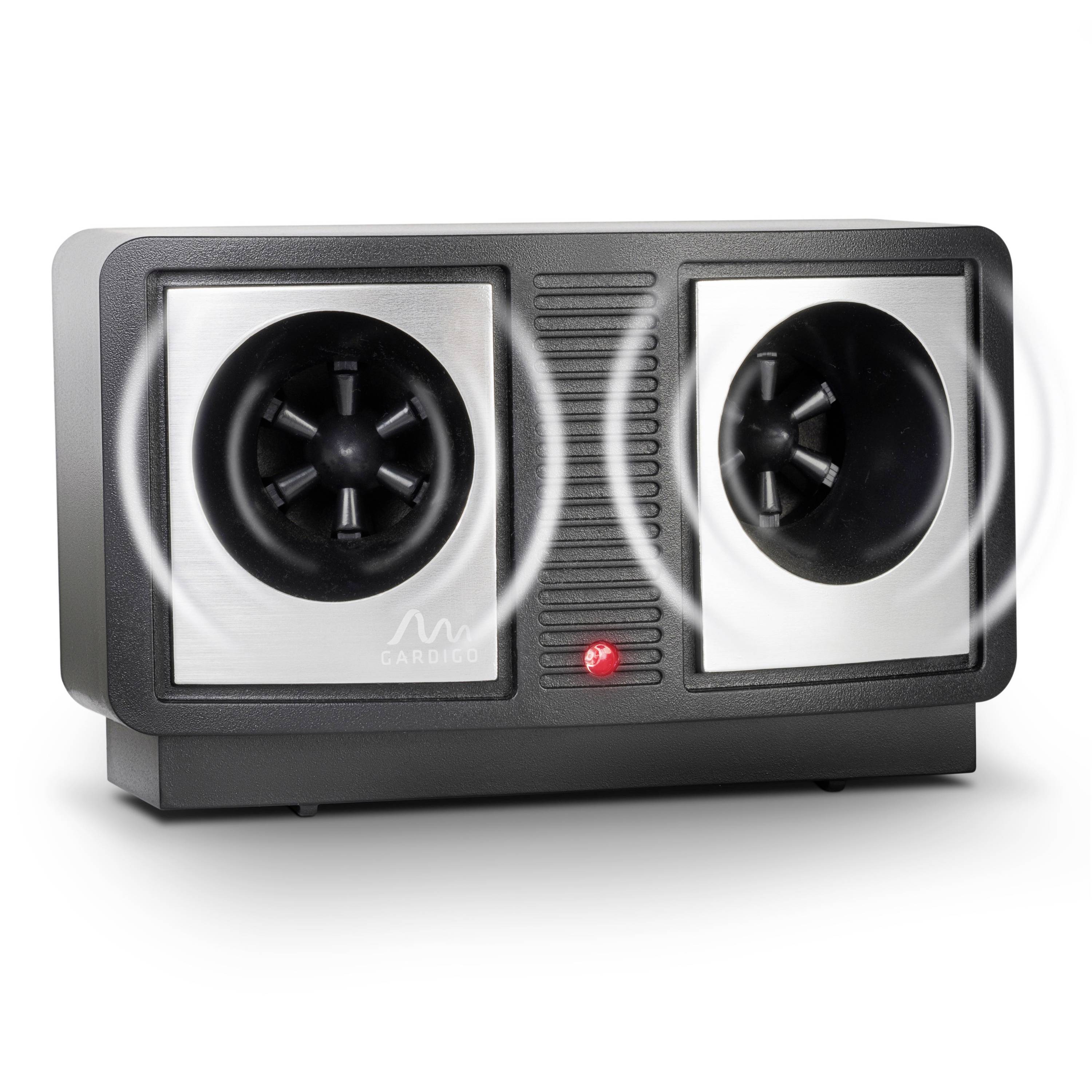 A device with two speakers emitting ultrasonic tones to deter pests. Sound waves are visible in the foreground.