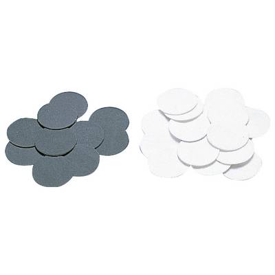 Black and white discs in two separate stacks, possibly used as grinding wheels or filter inserts.