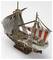 A detailed model of a pirate ship with large sails and a laughing skull, surrounded by red stripes.