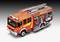 A red fire engine with hoses and equipment on its sides, standing on a street.