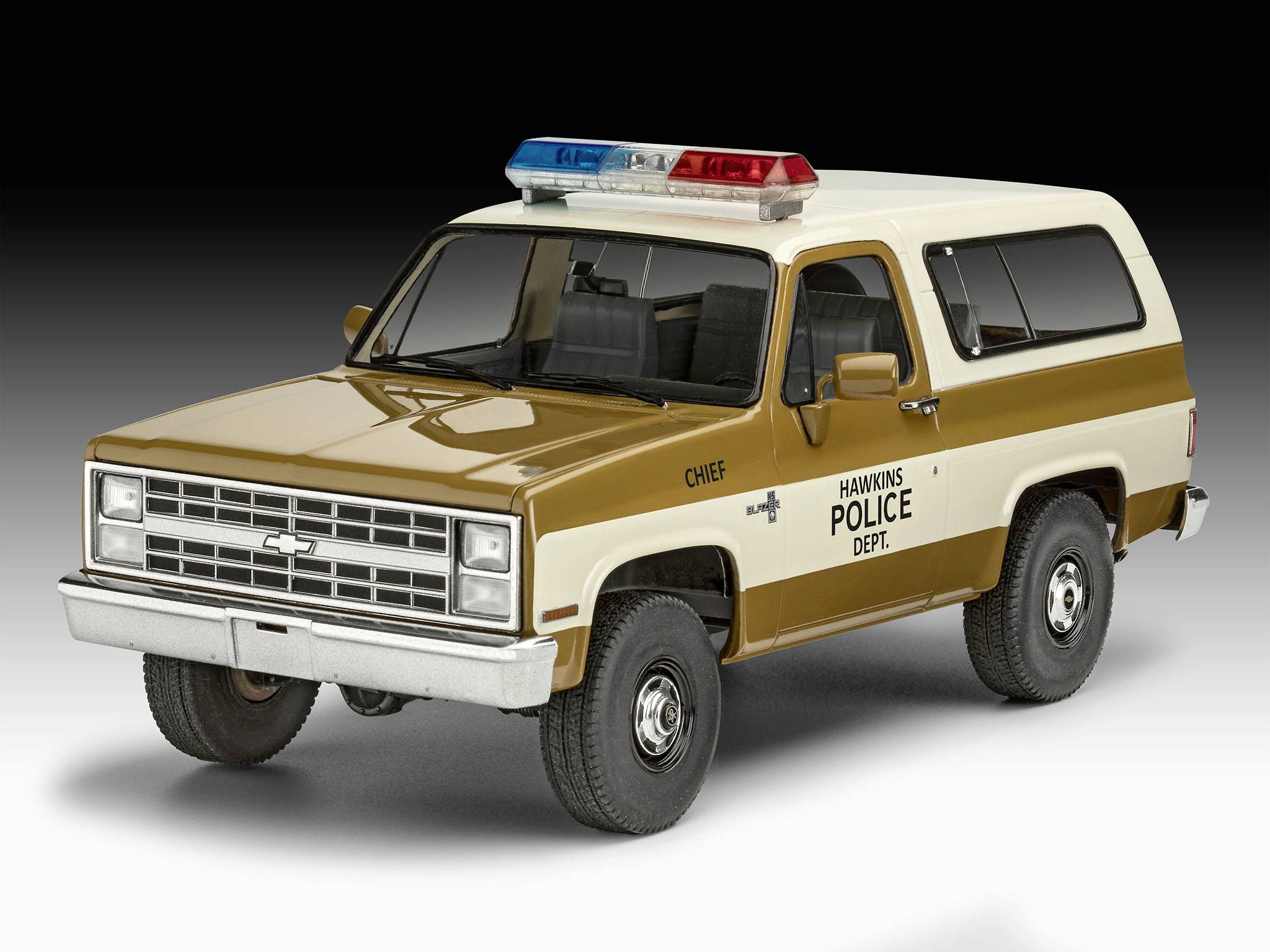 A model police car with 'Hawkins Police Dept.' written on the side and a red and blue light bar on the roof.
