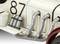 A model car engine, white with the number '87' and silver pipes, shows detailed parts of a classic car.