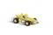 A yellow toy car figurine with a cartoon character at the wheel. The car is moving quickly to the left.