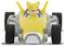 A yellow toy figure with fox ears sits in a yellow racing car. The figure has a concentrated expression.