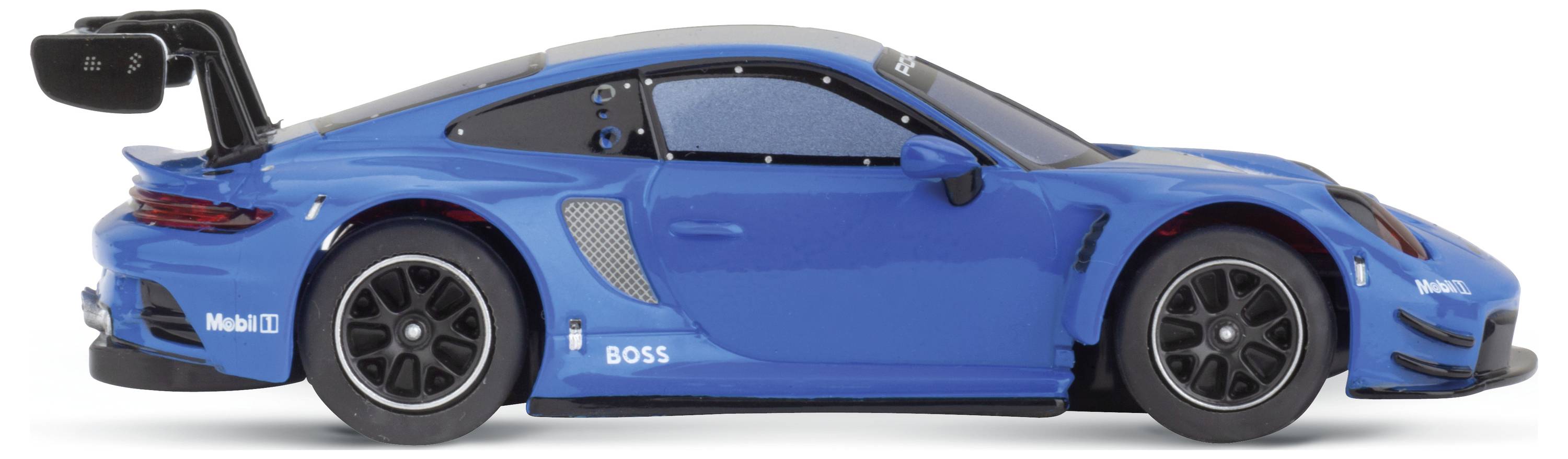 Blue model racing car with prominent rear spoiler sits on a white surface.