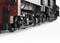 Black and red locomotive, close-up of wheels and drive technology, showcasing the complexity and mechanics of the railway.