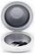Round container with open lid, contains a black car key.