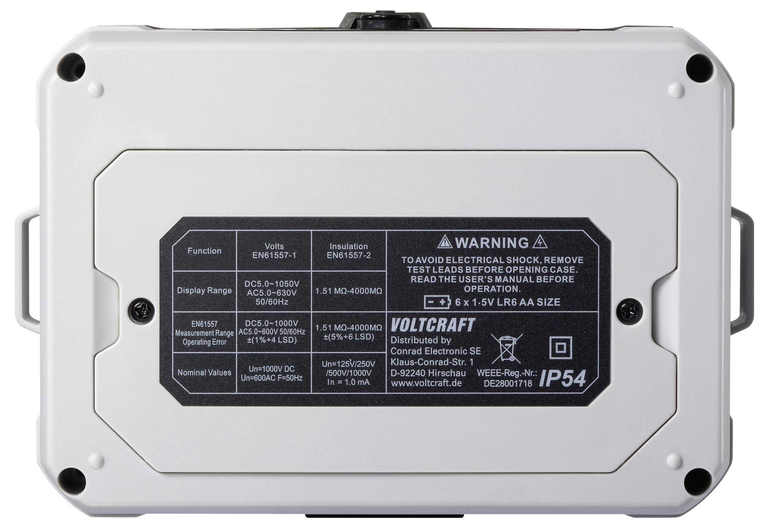 The image shows the back of a Voltcraft device with a technical label detailing voltage functions, insulation standards, and a warning for electrical shock.