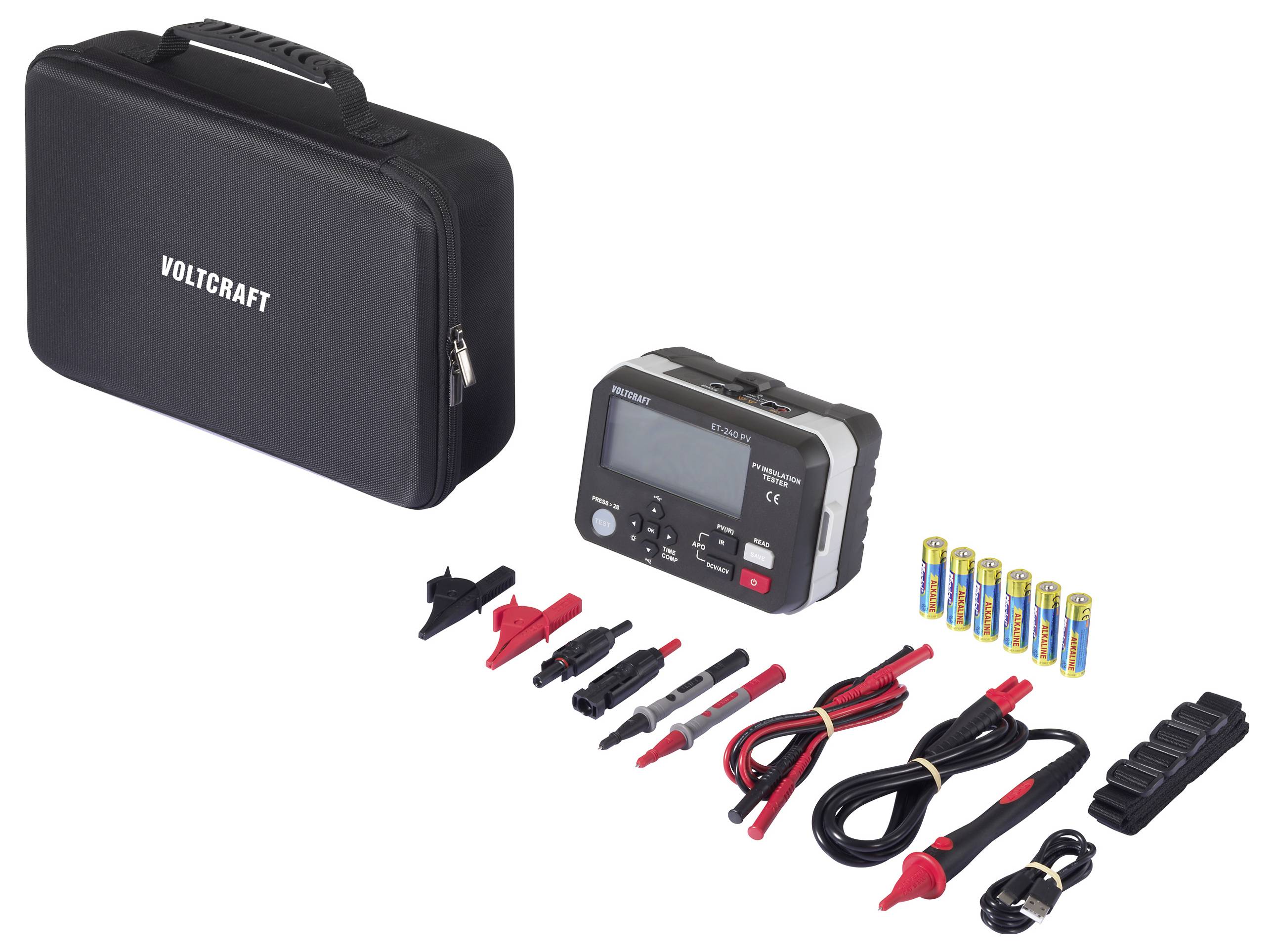 A black case with 'VOLTCRAFT' logo, an electrical testing device, batteries, various cables, and connectors are arranged on a white surface.