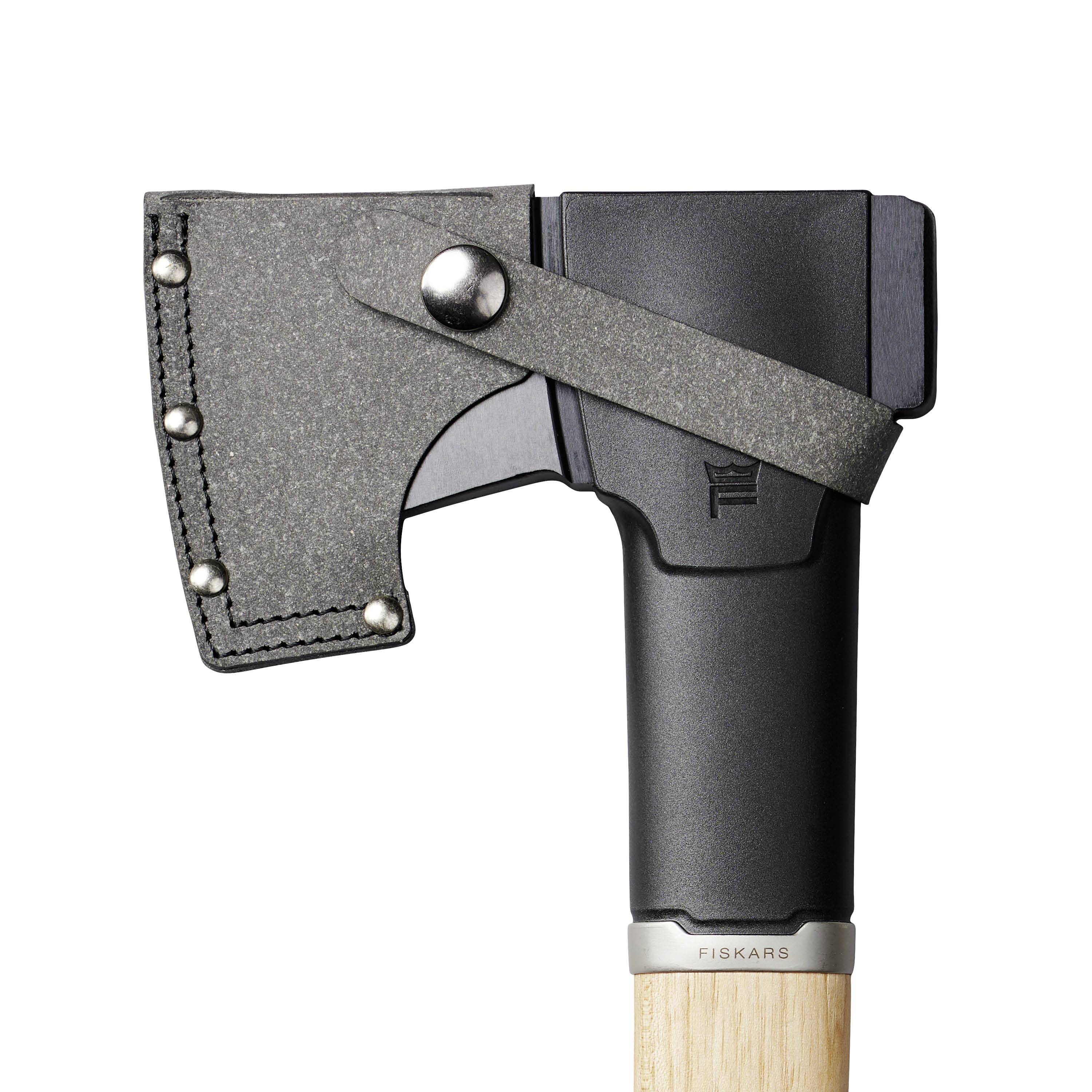 Axe with a black handle and protective cap on the head, shown brand 'Fiskars'.