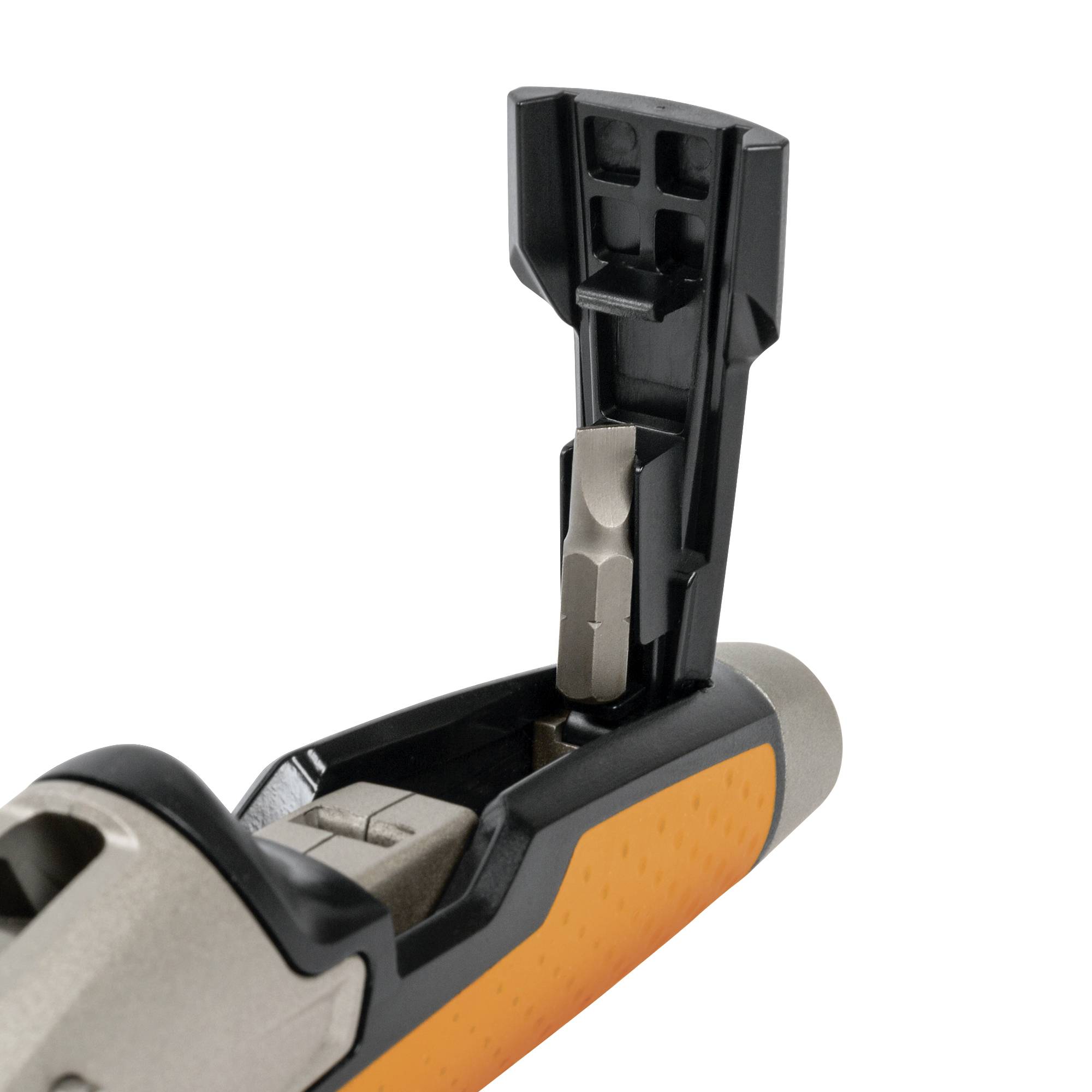 An orange-grey plastic object with an open lid, revealing a small mechanism inside, likely a tool.