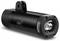 A black bicycle light with a rectangular light output and a centrally positioned on/off switch, mountable through a mounting slot.