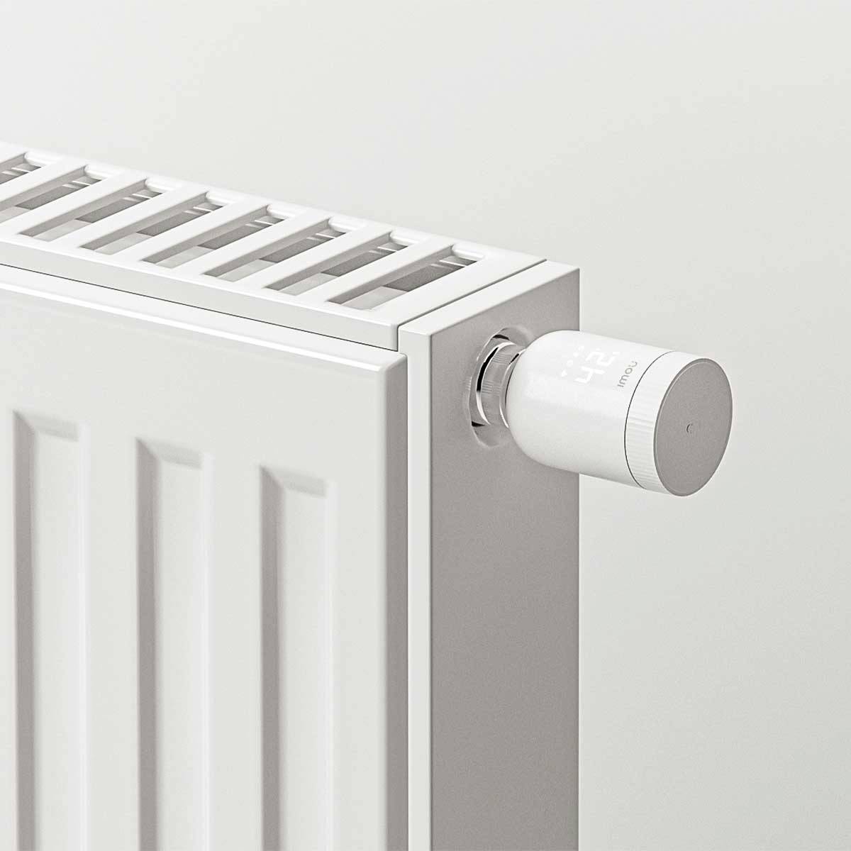 Radiator with a digital thermostat set to 42°C, demonstrating modern temperature control in a living space.