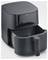 Black hot air fryer with open basket. Suitable for low-fat frying of food. Brand name on the front.